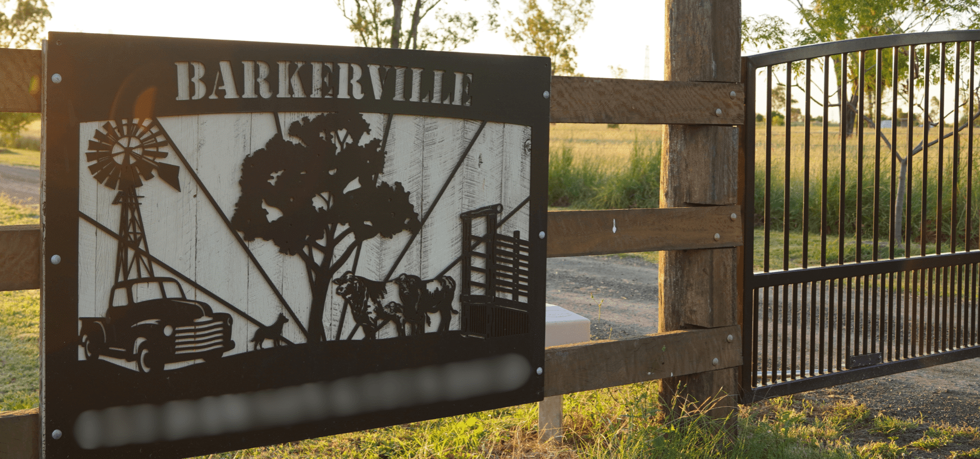 Steel gate entrance sign