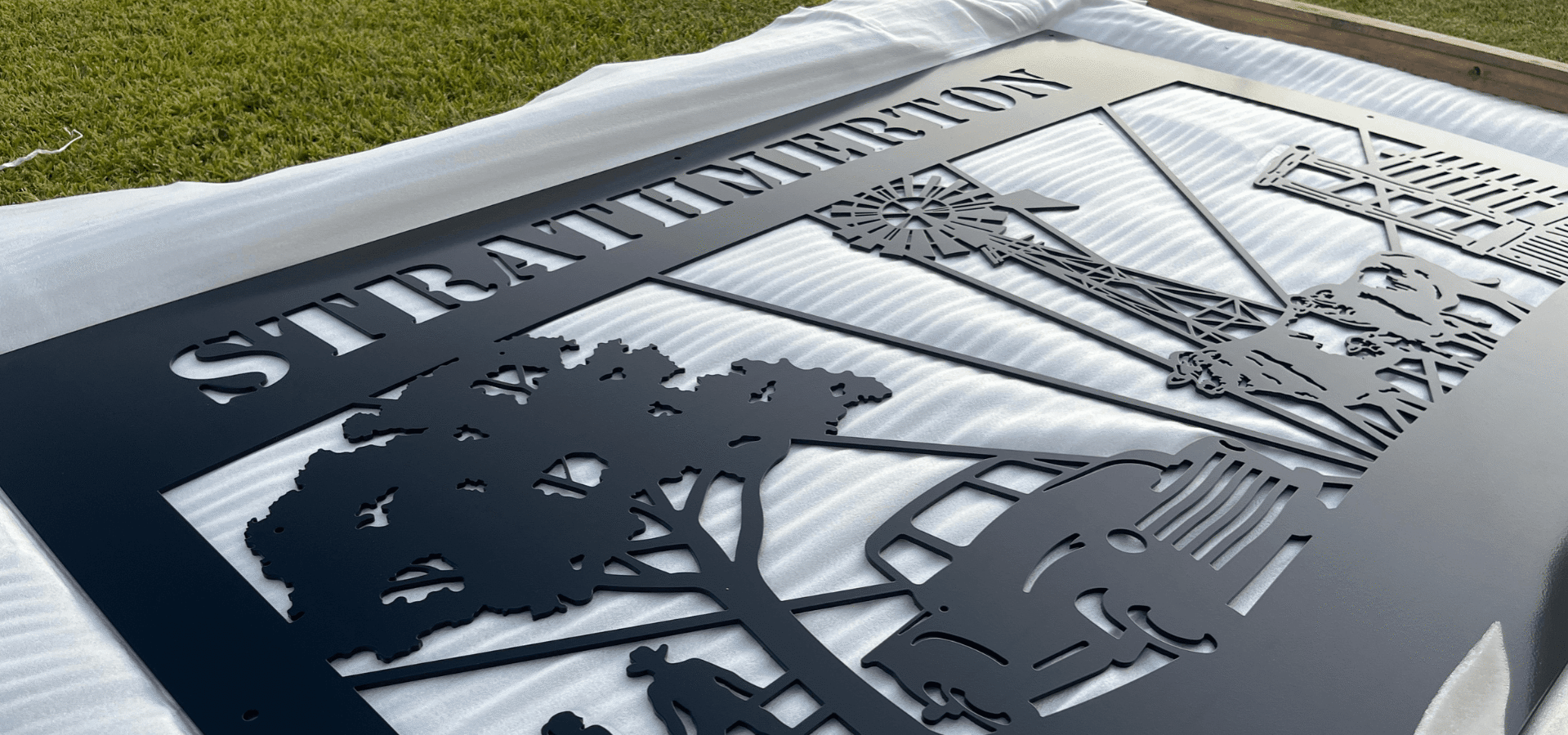 Painted steel farm sign